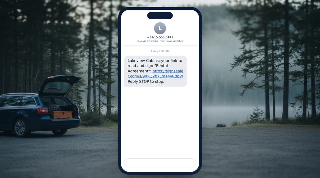 A phone in a trailhead car park showing a text message from Lakeview Cabins' own number: it carries Lakeview Cabins' link to read and sign a rental agreement, and ends with Reply STOP to stop.